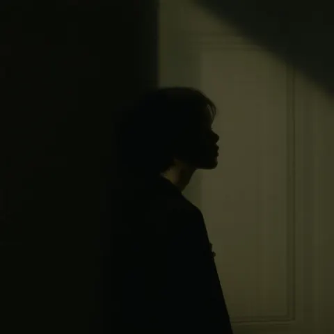 Chiaroscuro Portrait Of A Solitary Figure