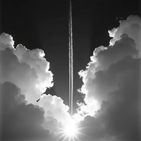 Lone Chemtrail Between Clouds in Monochrome