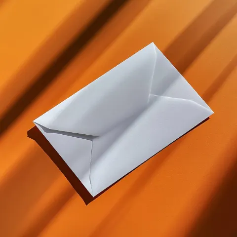 White envelope on orange table