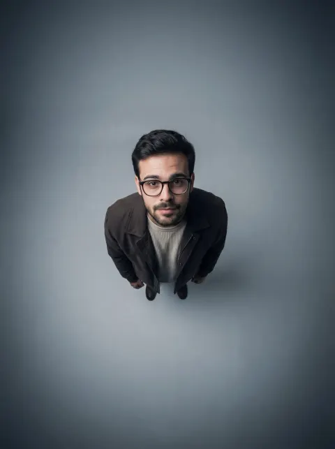 Full Body Portrait from Extreme High Angle, Conveying Isolation and Vulnerability