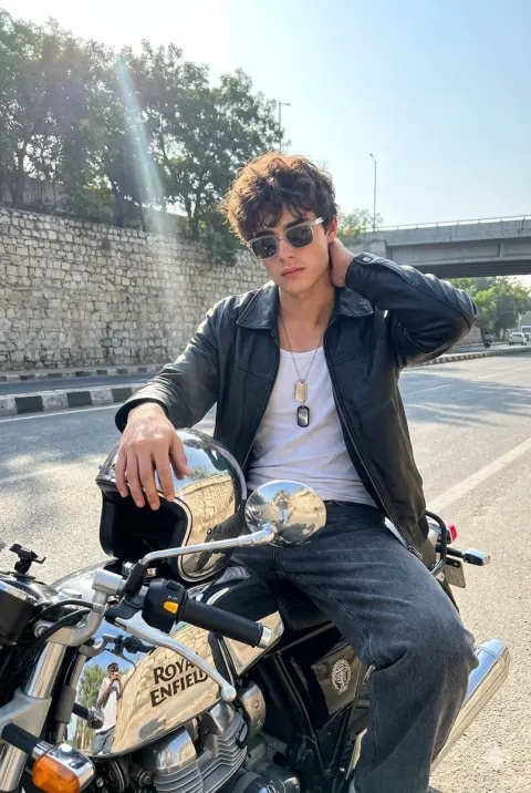 Realistic photo of young man on motorcycle