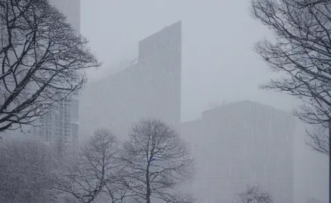 Snow Falling on Brutalist High Rise Buildings