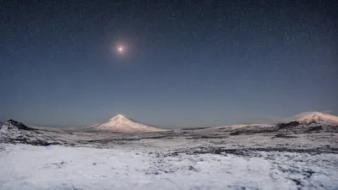 Cold Icy Landscape under a Clear Starry Sky