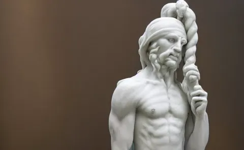 Marble Sculpture of an Illythid in Glass Case Inside a Museum Surrounded