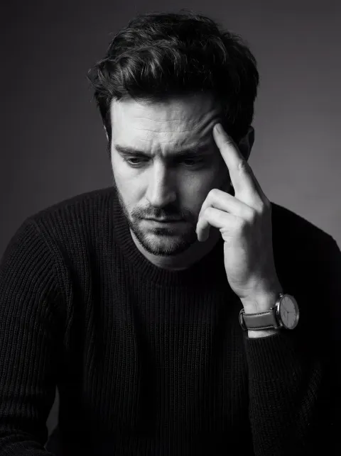 Contemplative Monochrome Portrait in Studio Light