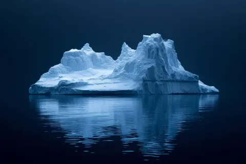 Sculpted Iceberg at Night Reflection