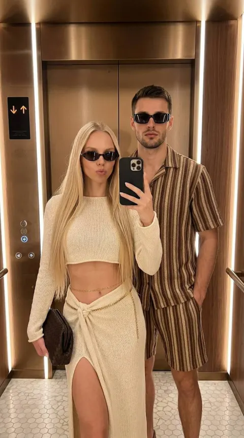 Stylish Couple Elevator Selfie