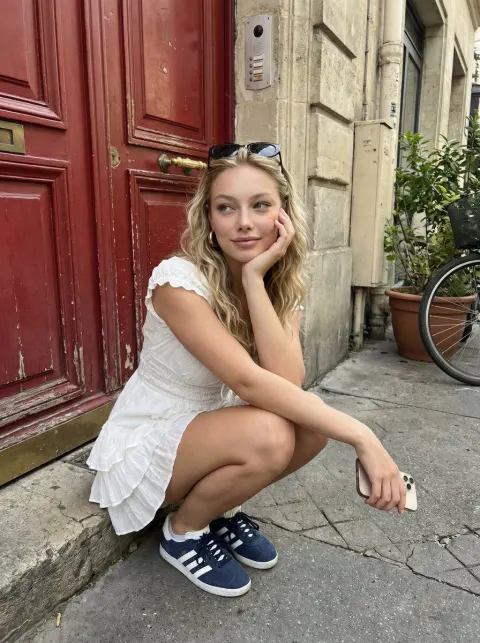 Squatting Girl by Red Door