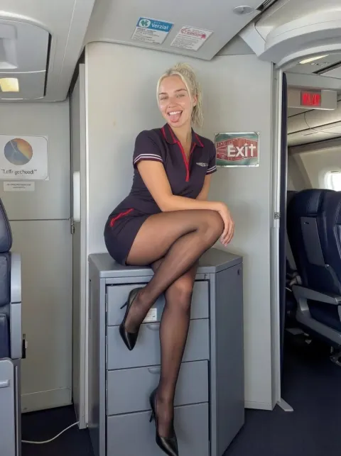 Playful Flight Attendant Tongue Out