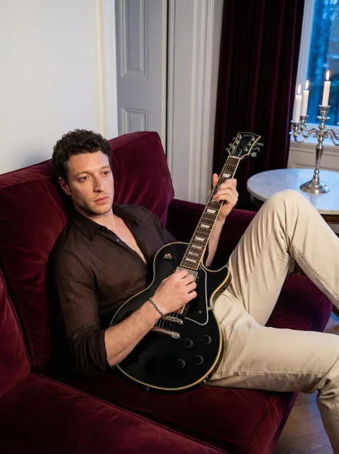 Guitarist on Velvet Sofa