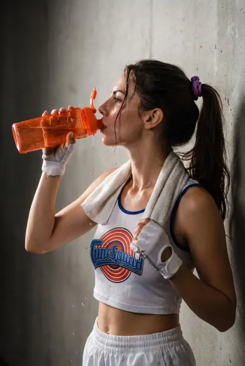 Retro Sportswear Woman Drinking Water