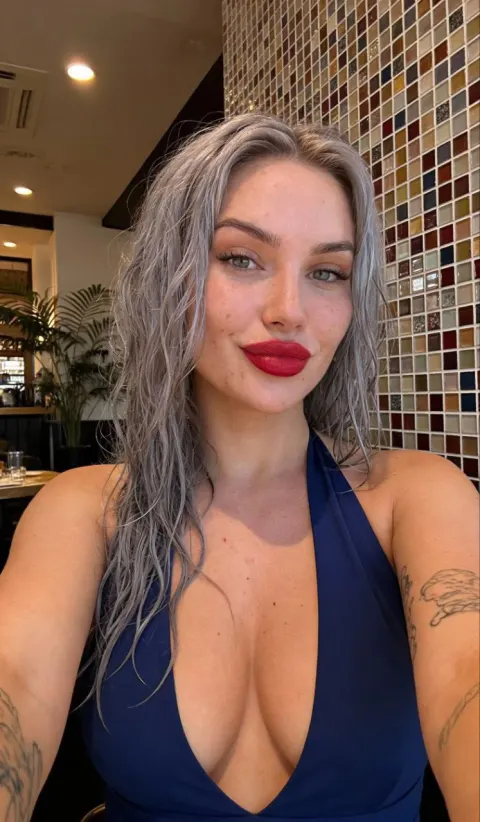 Playful Café Low-Angle Selfie Portrait