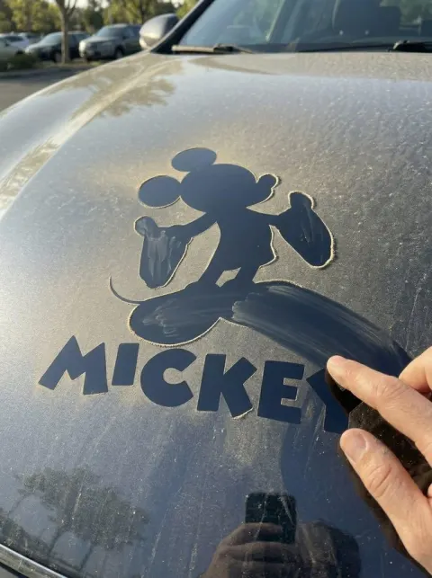 Dust-Wiped Logo Reveal on Car Hood