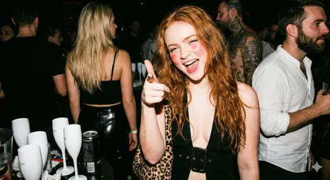 Candid Flash Portrait of a Redhead in the Club