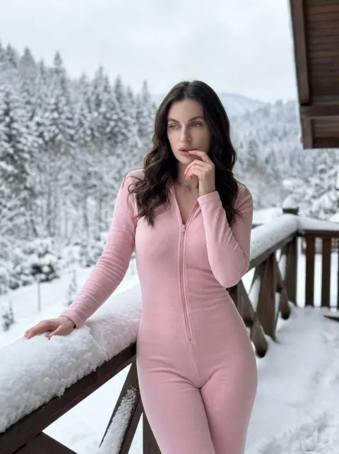 Pink Jumpsuit on Snowy Balcony