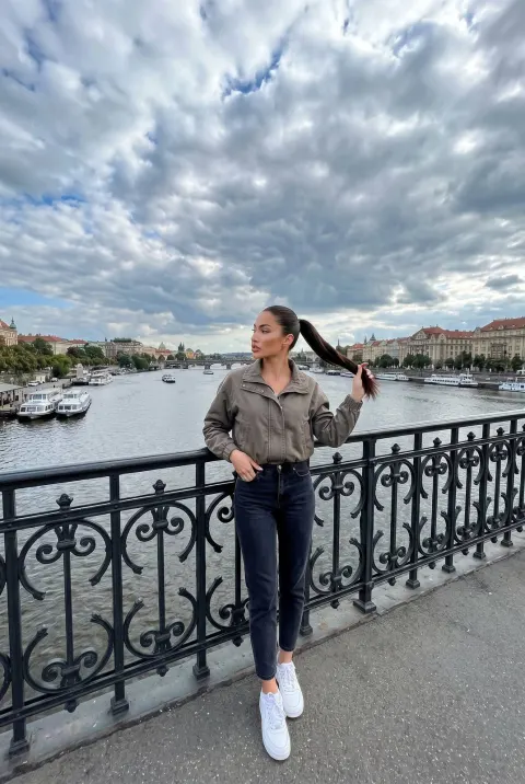 Casual Traveler on Historic Bridge
