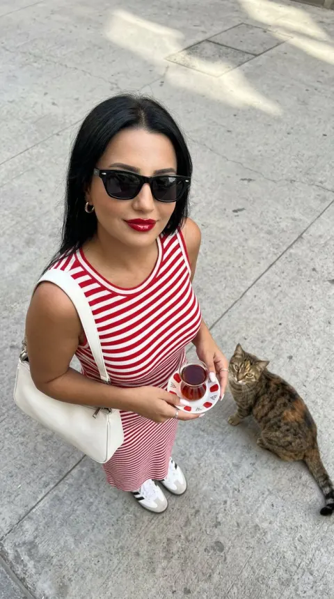 Stylish Woman with Street Cat