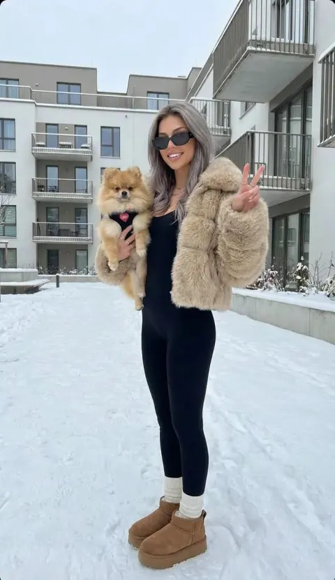 Winter Fashion Portrait With Pomeranian Dog