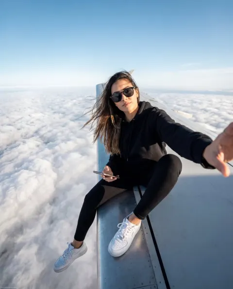 Wing Selfie Above Clouds