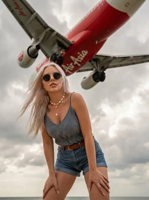 Kiss Pose Under Landing AirAsia Plane