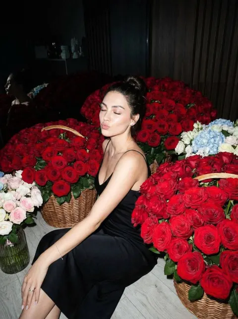 Woman Surrounded By Red Roses