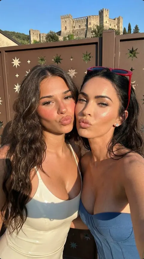 Glamorous Duo Selfie Kiss