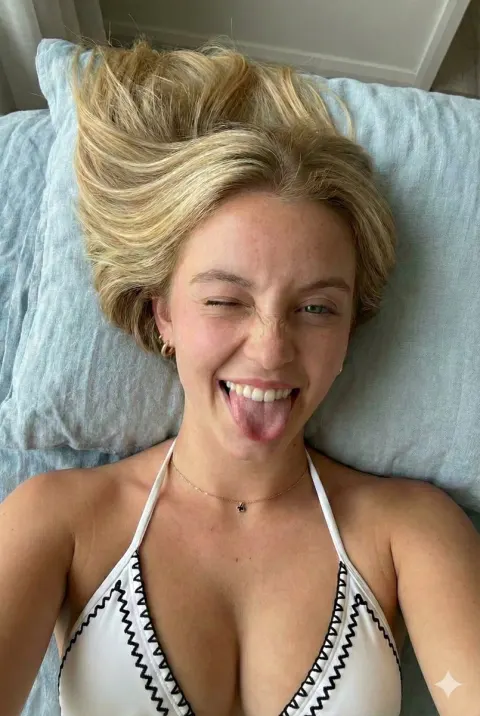 Playful Wink in Black Bikini