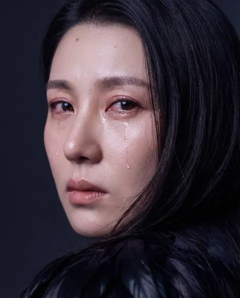 Tearful Girl in Feathers