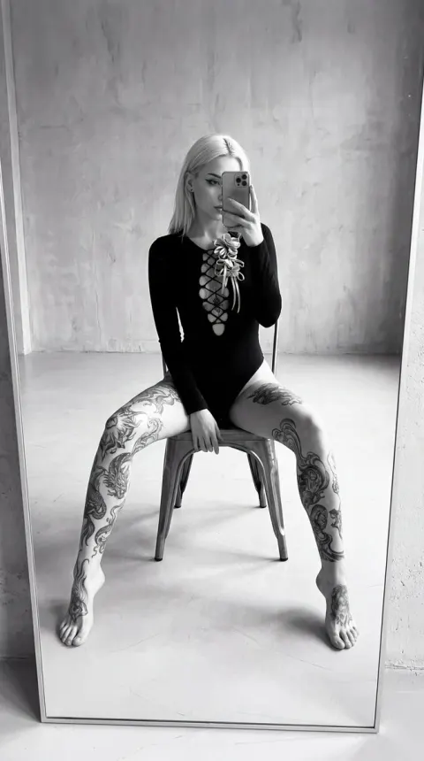 Tattooed Woman Mirror Selfie