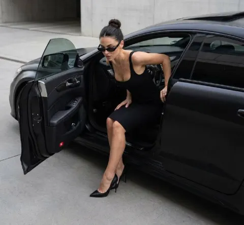 Elegant Woman Exits Luxury Mercedes