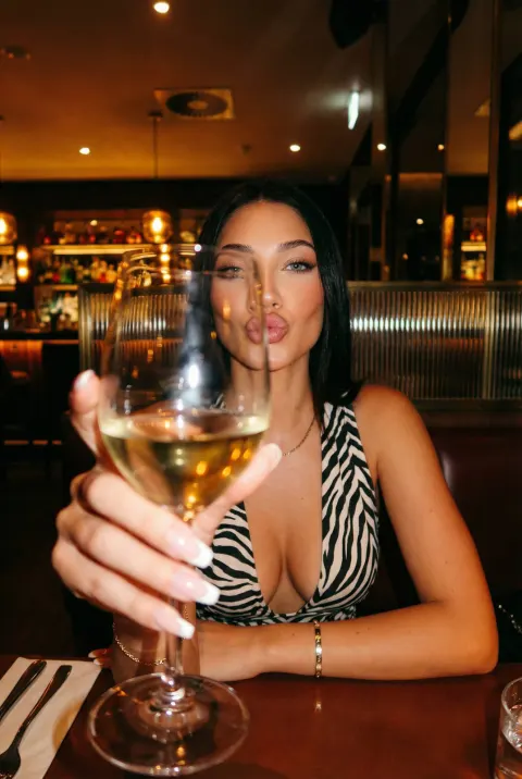 Elegant Evening Wine Moment in Luxury Lounge