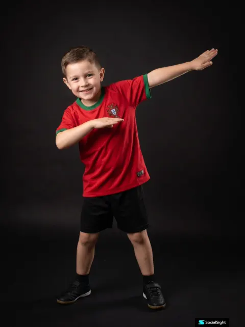 Cheerful Kid in Pro Football Studio Portrait