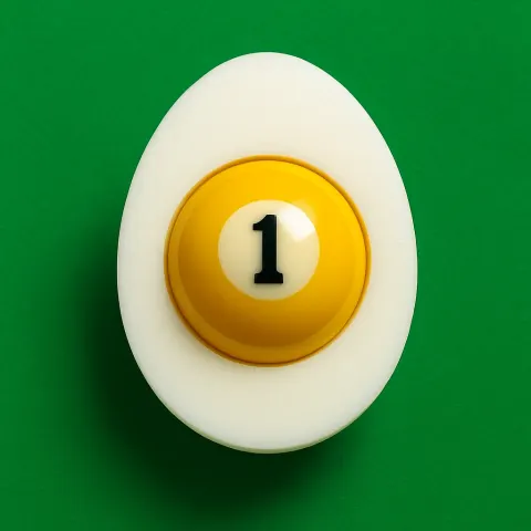 Half boiled egg with  yellow billiard ball