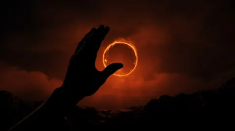Hand Holding Annular Eclipse Dramatic Silhouette