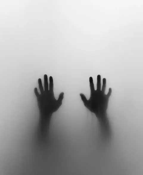 Eerie Hands Behind Glass