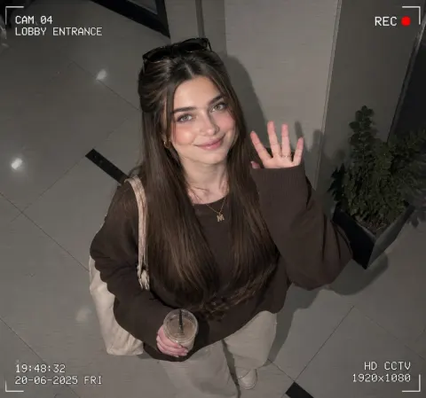 CCTV Girl Waves at Camera