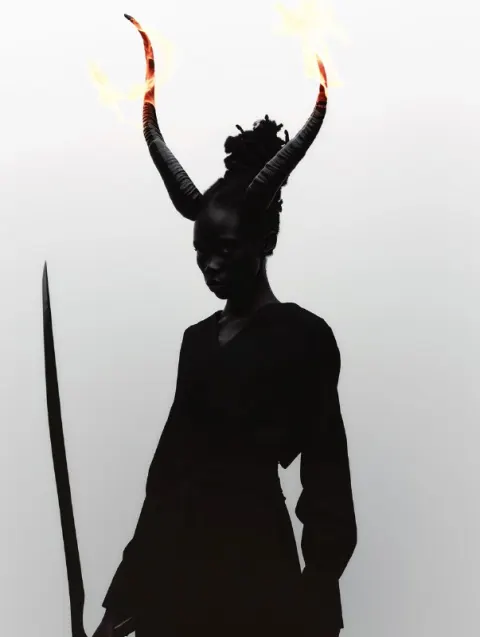 Horned Woman Wielding Flaming Sword Dark Portrait