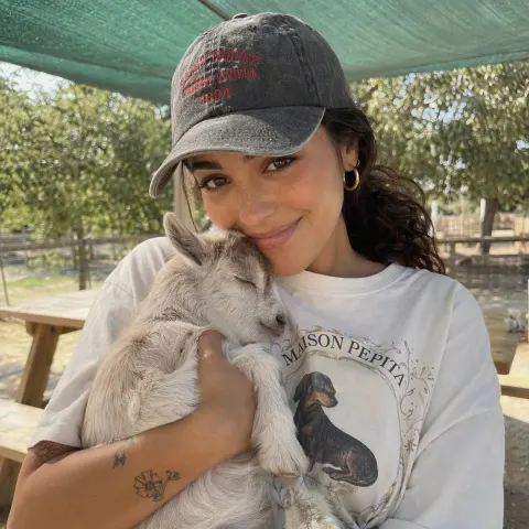 Girl Holding Baby Goat Portrait