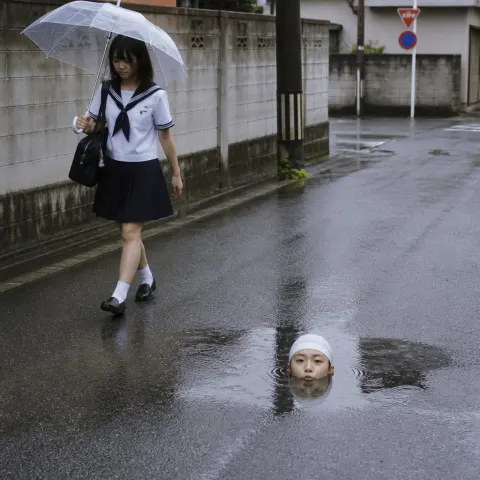 Rainy Street Surrealism: Rising Head