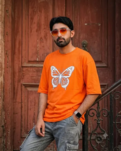 Stylish Man in Orange Butterfly Tee