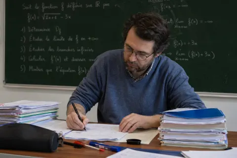 Math Teacher Grading Papers