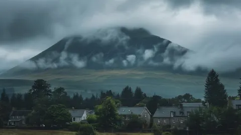 Scottish Highlands Mountain Village Under Gloomy Sky