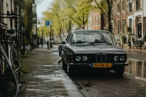 Vintage BMW in Rainy Dutch Street