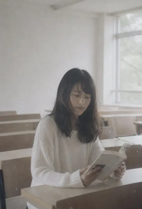 Anonymous Reader by Sunlit Window