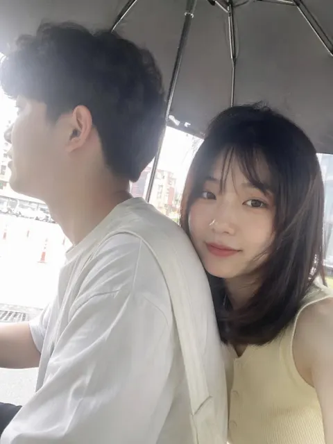 Couple Under Umbrella Selfie