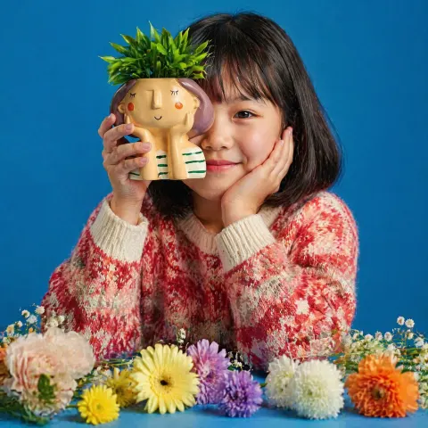 Girl With Flowers Blue Studio Shot