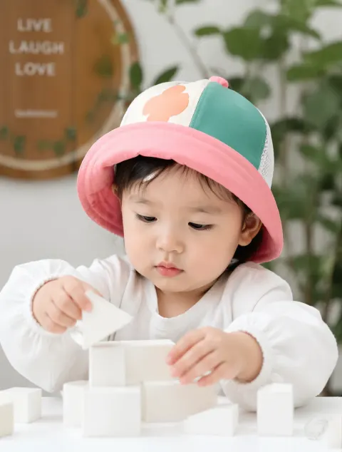 Toddler Playing With White Blocks