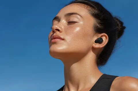 Serene Woman With Wireless Earbuds