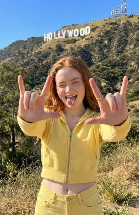 Playful Girl at Hollywood Sign