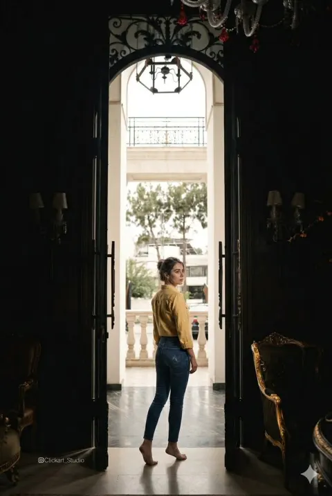Woman In Dark Doorway Backlight Portrait